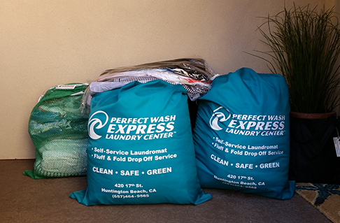 Express Laundry Bags filled with clothes